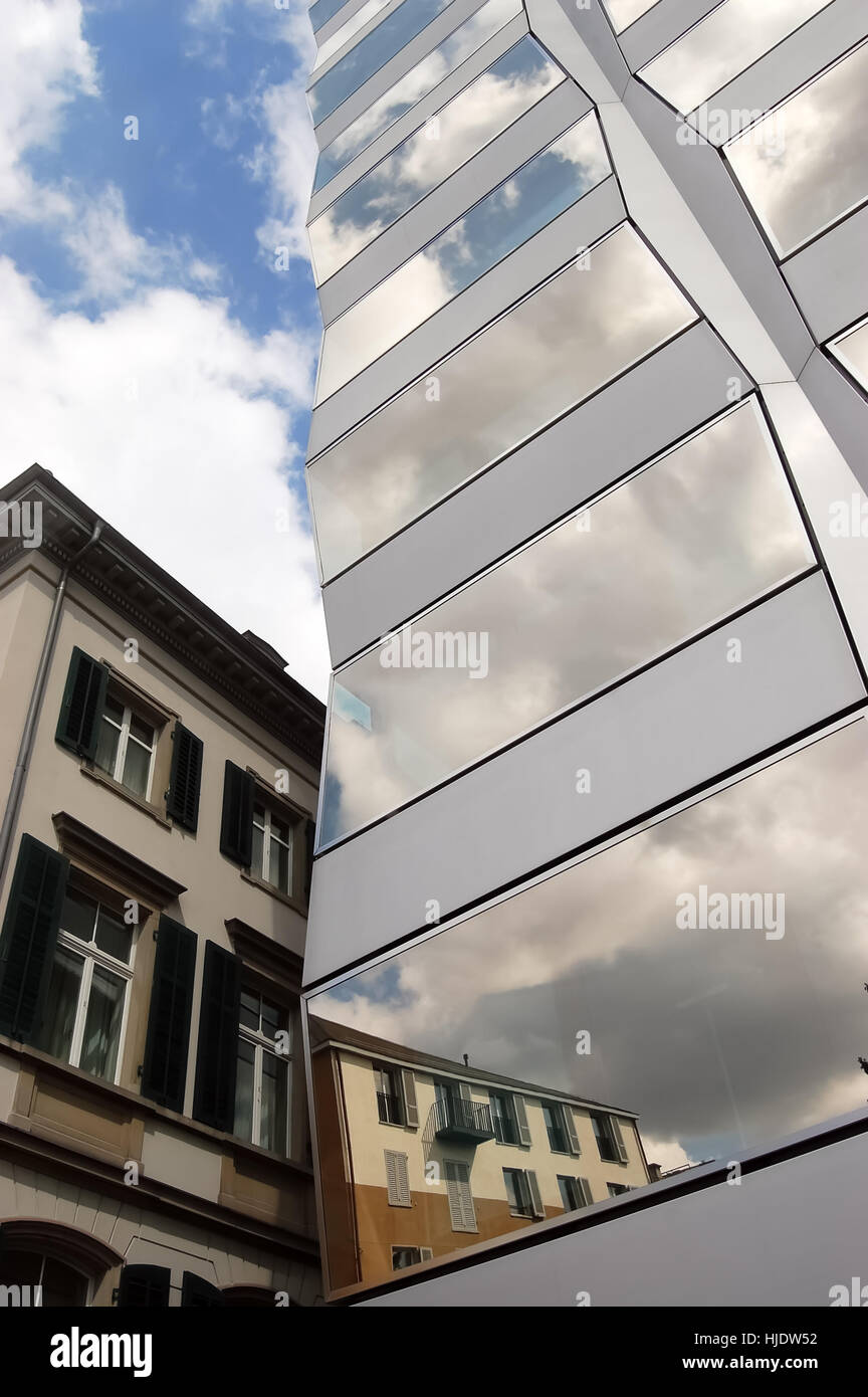 Fragments of old and modern buildings in the reflection in Swiss city. Stock Photo