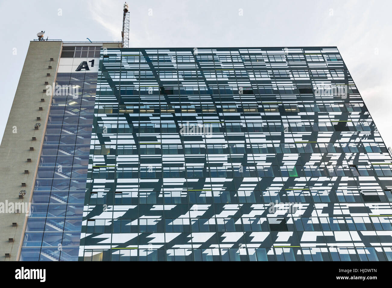 GRAZ, AUSTRIA - SEPTEMBER 11, 2015: The Telekom highrise tower A1 building facade. It hosts the headquarters of A1 Telekom Austria telecommunications  Stock Photo