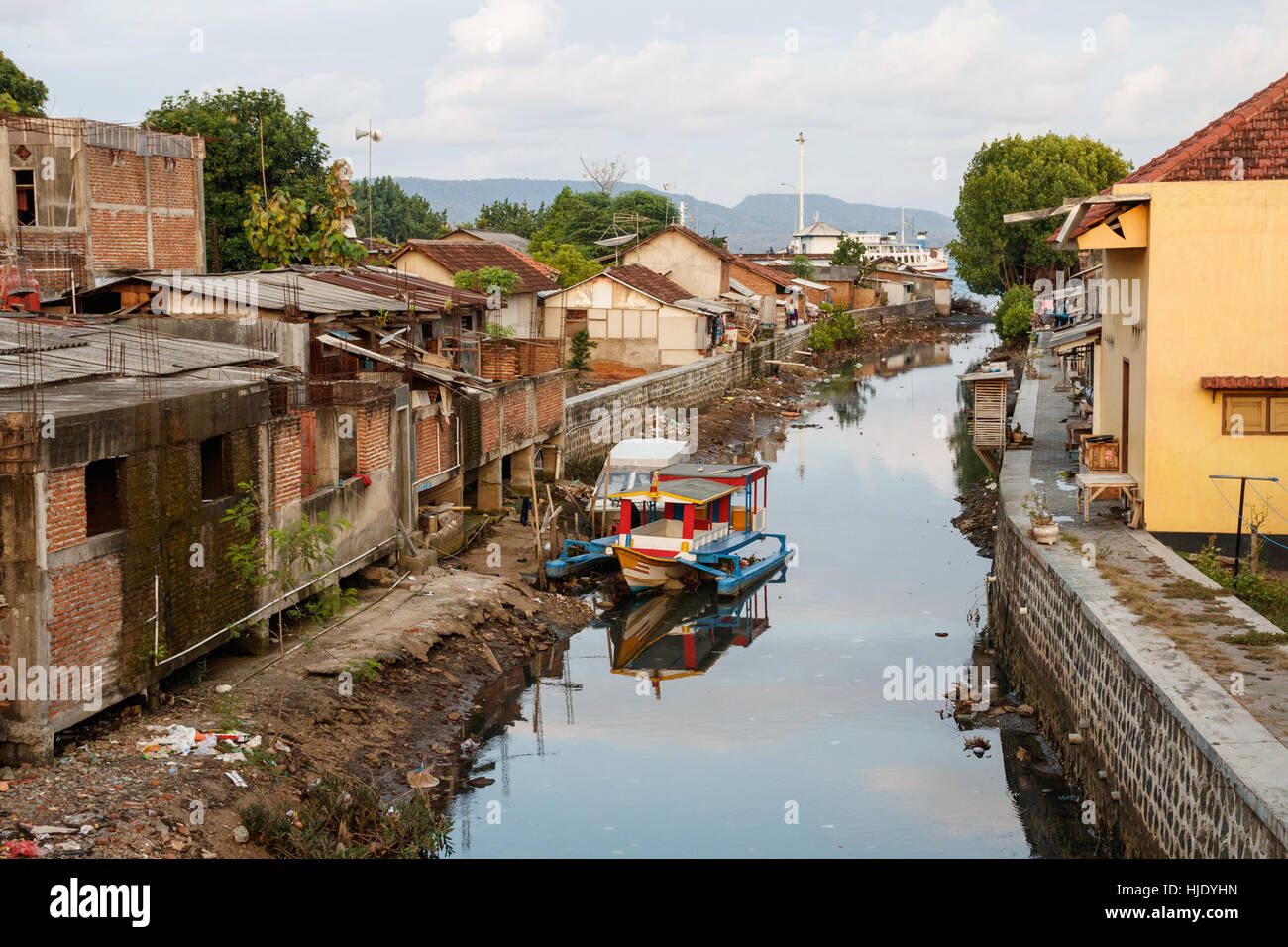 View over slums on the banks of a small river flowing through Banyuwangi, Java, Indonesia. Stock Photo