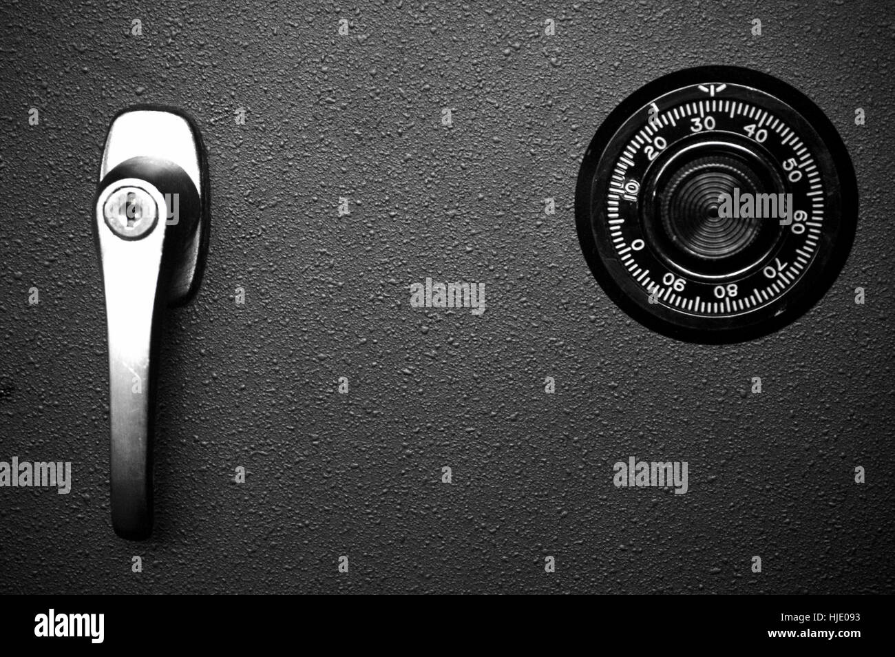 A safe combination lock dial and door handle. Stock Photo