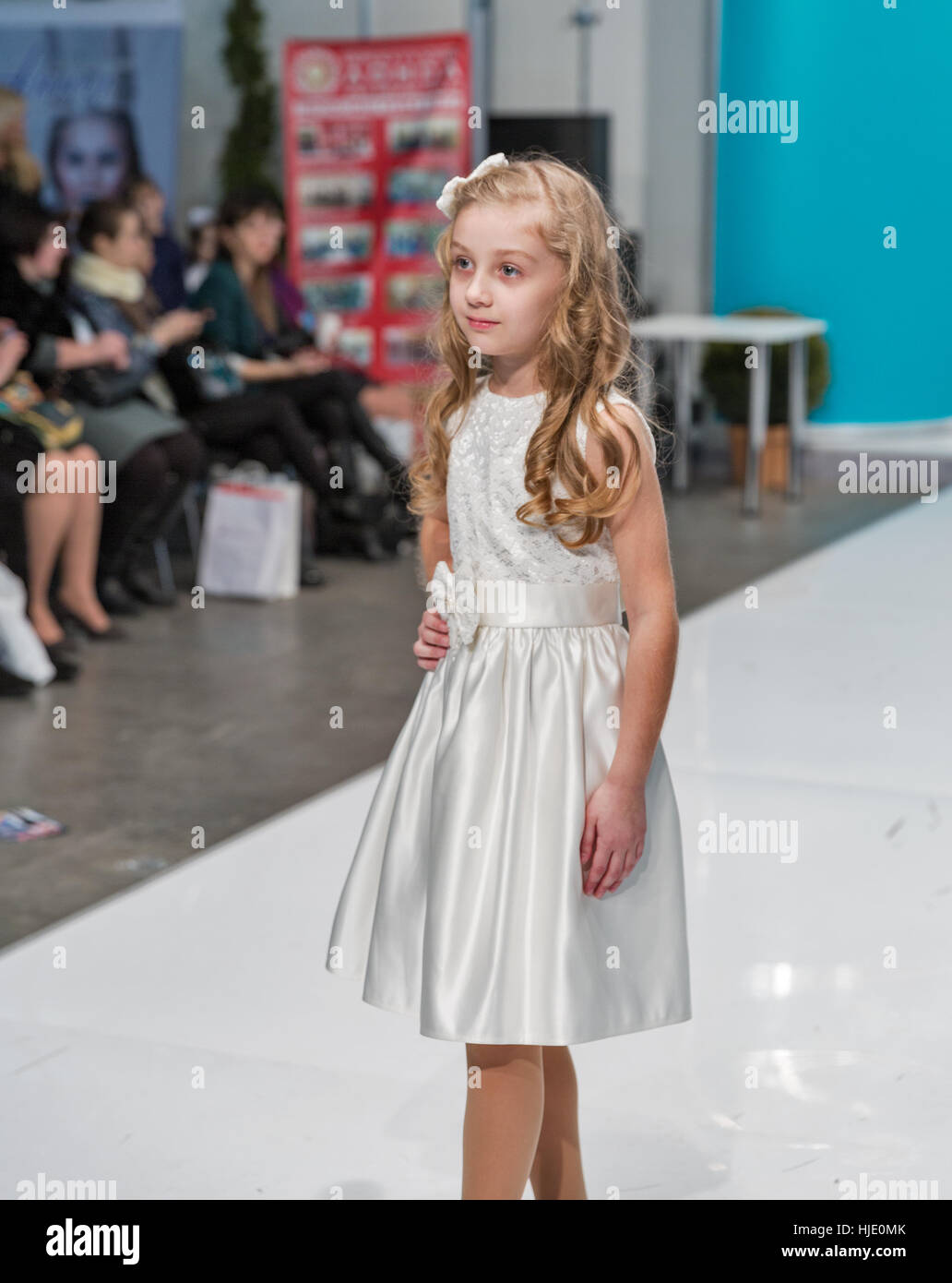 KIEV, UKRAINE - FEBRUARY 04, 2016: Children fashion model at Kyiv Fashion 2016 show in KyivExpoPlaza exhibition center. It was the 30th edition of pop Stock Photo