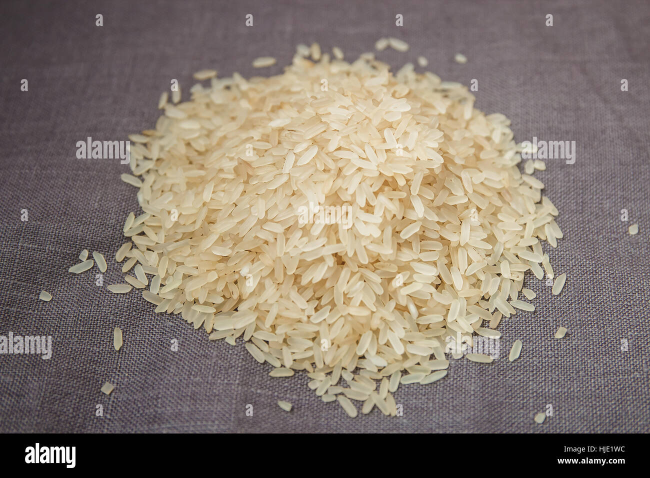Rice on gray background Stock Photo - Alamy