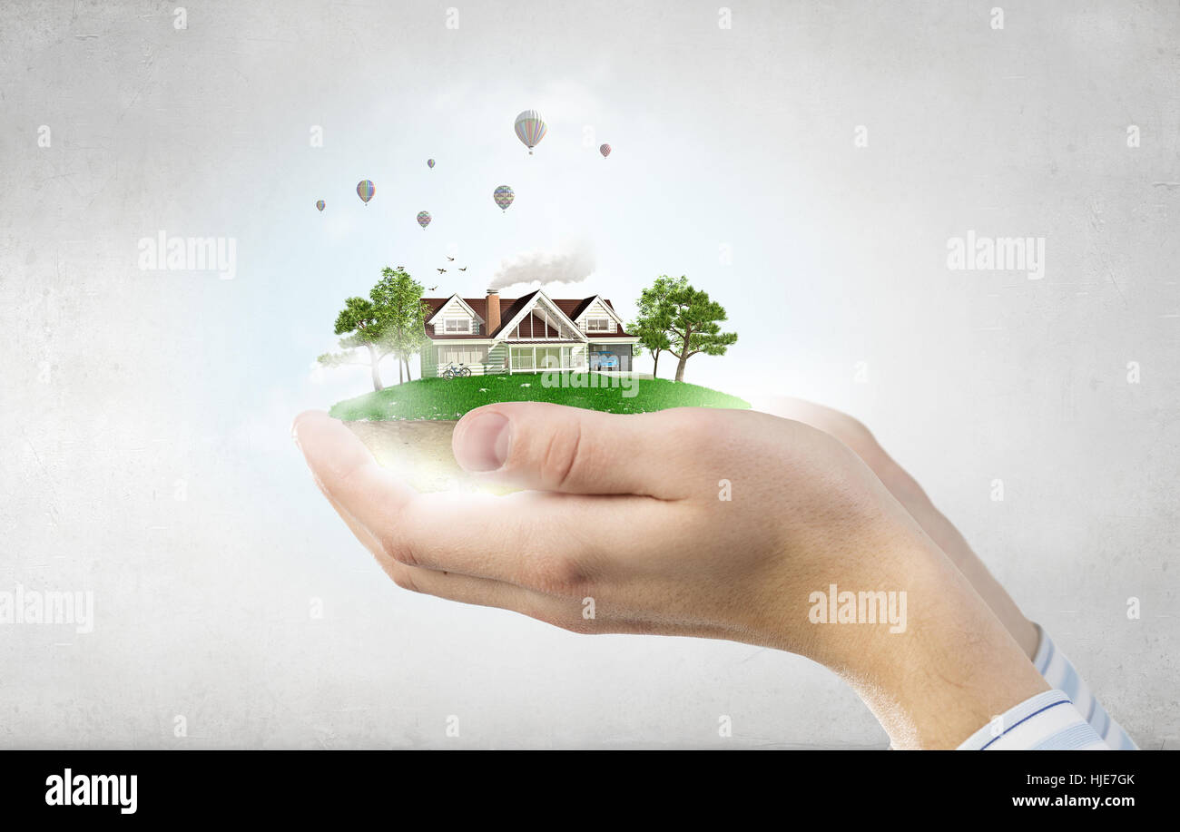 Human hands holding model of dream house Stock Photo - Alamy