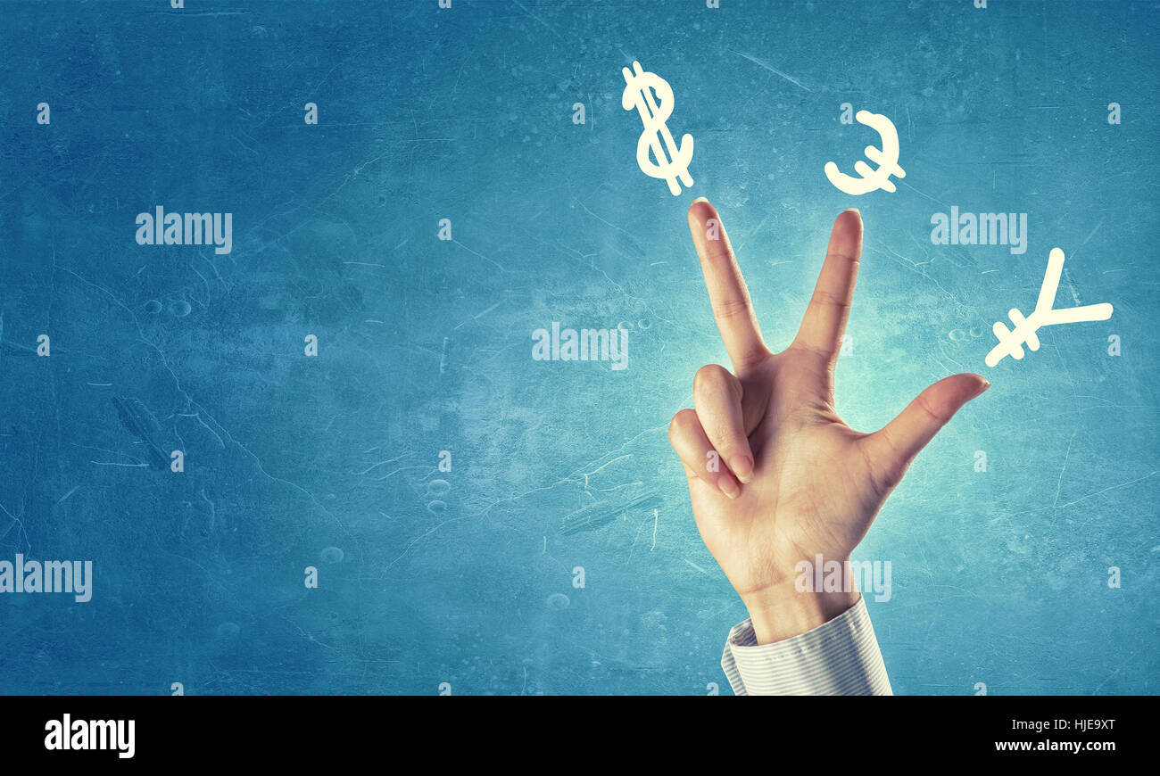 Hands and money currency signs on fingers hi-res stock photography and ...