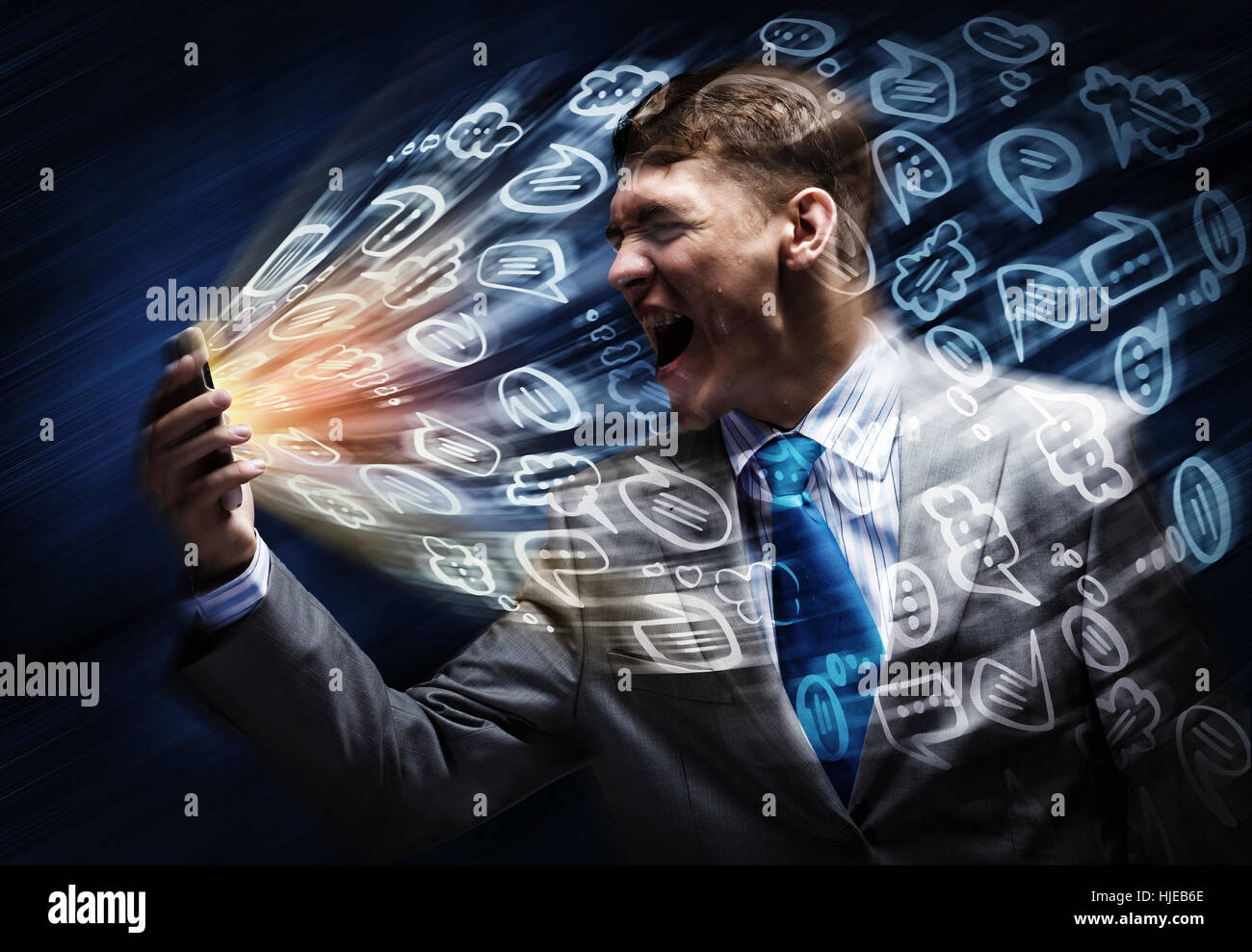 Aggressive businessman screaming fiercely in mobile phone Stock Photo ...