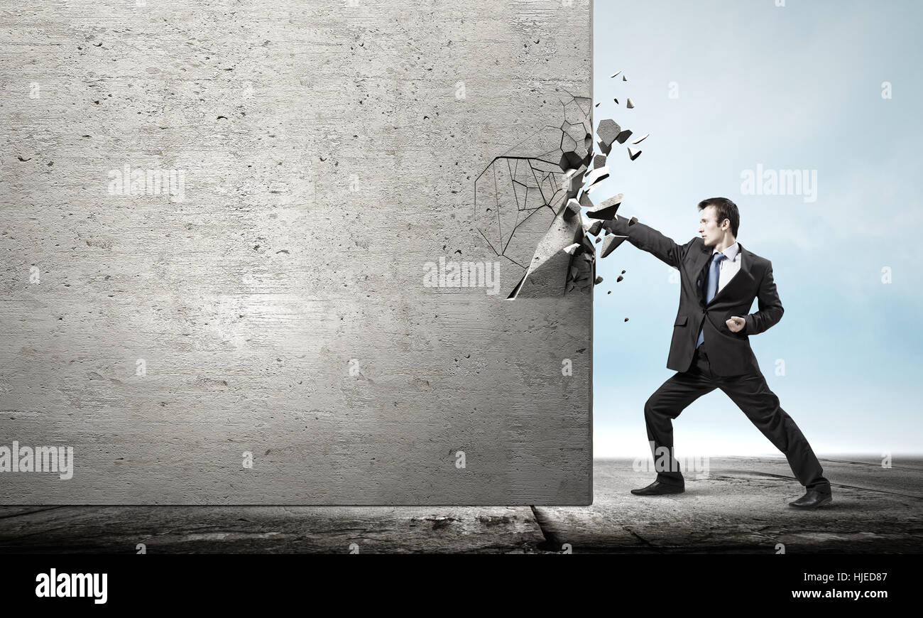 Businessman breaking stone wall karate hi-res stock photography and ...