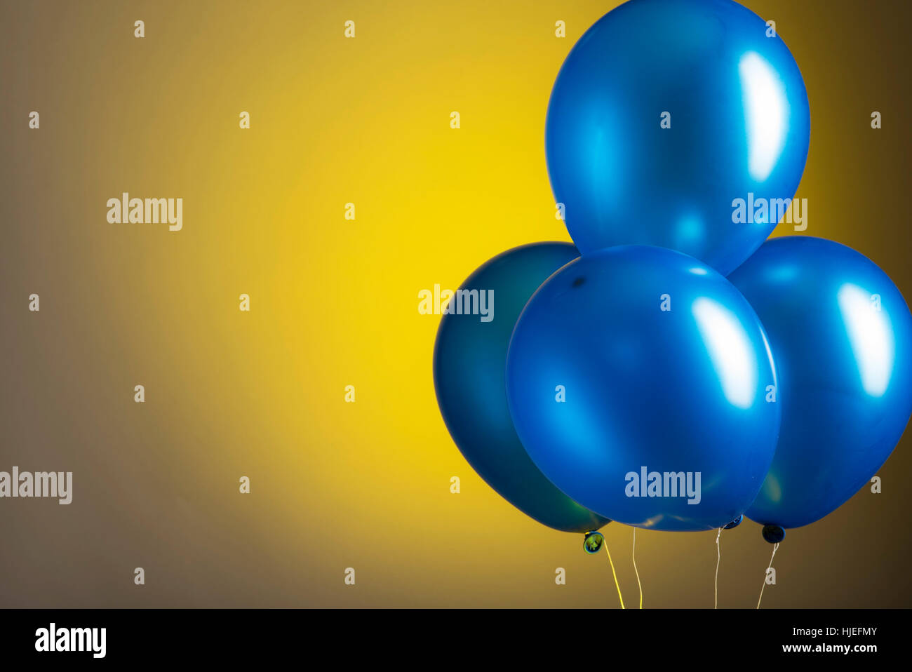 Blue party balloons on graduated background Stock Photo - Alamy