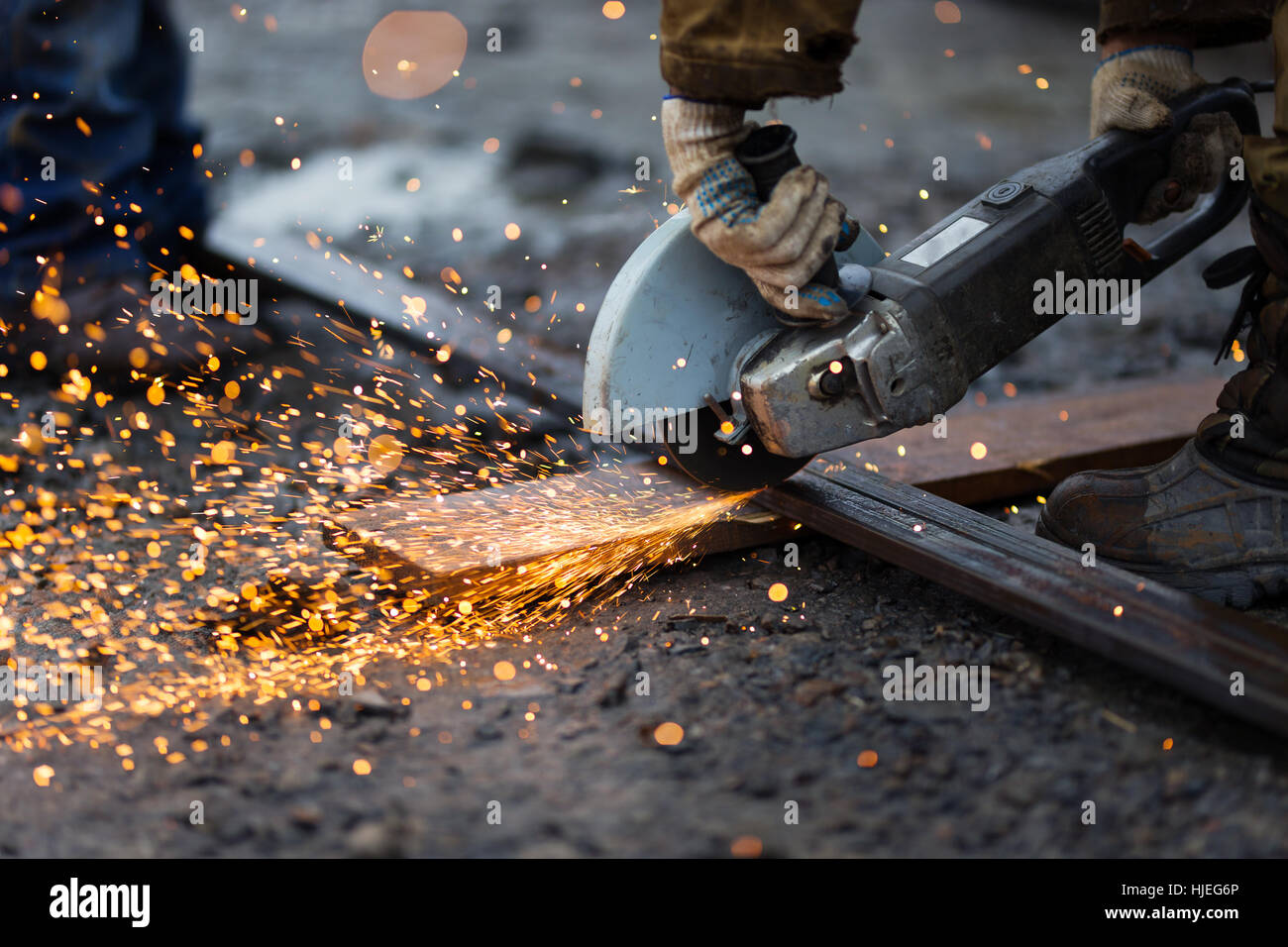 Cutting metal with angle grinder. Stock Photo