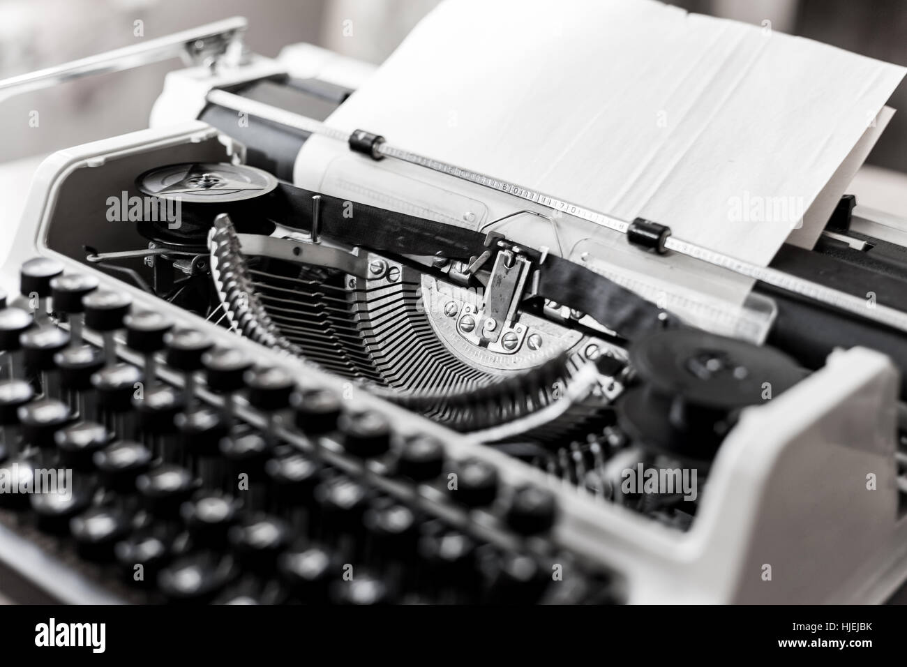 Retro old typewriter with paper sheet Stock Photo - Alamy