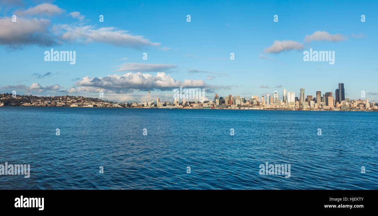 Clouds hover of the Seattle skyline on a sunny spring day Stock Photo ...