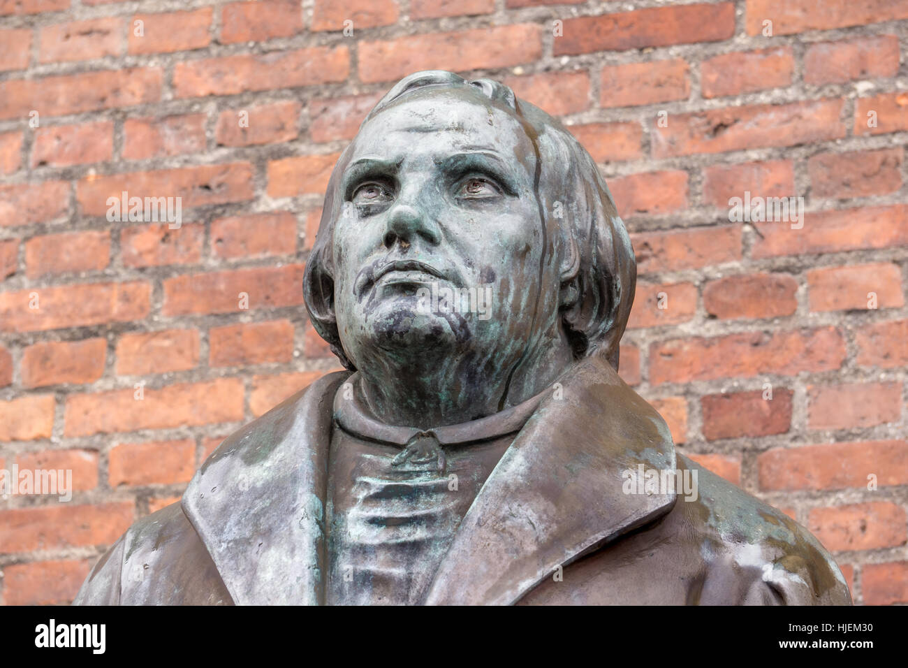 Bronze statue of the reformer Martin Luther in front of Luther church in Copenhagen, Denmark, January 21, 2017, Stock Photo