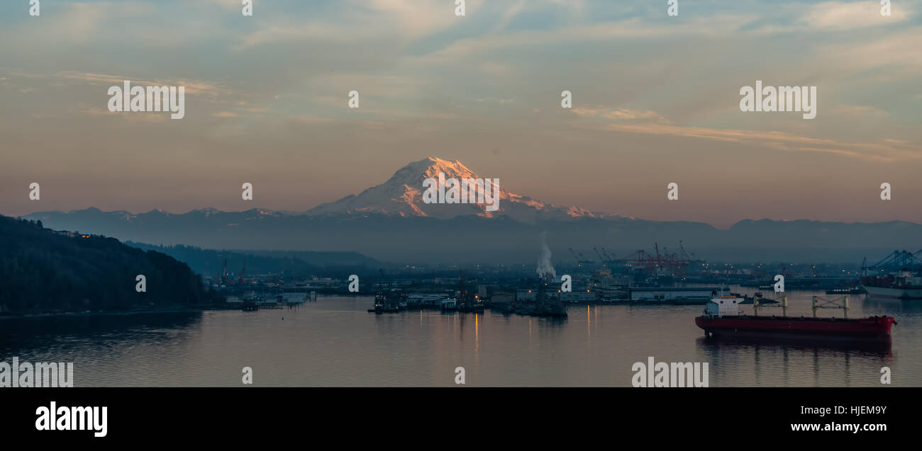 A view of the Port of Tacoma and Mount Rainier at sunset Stock Photo ...