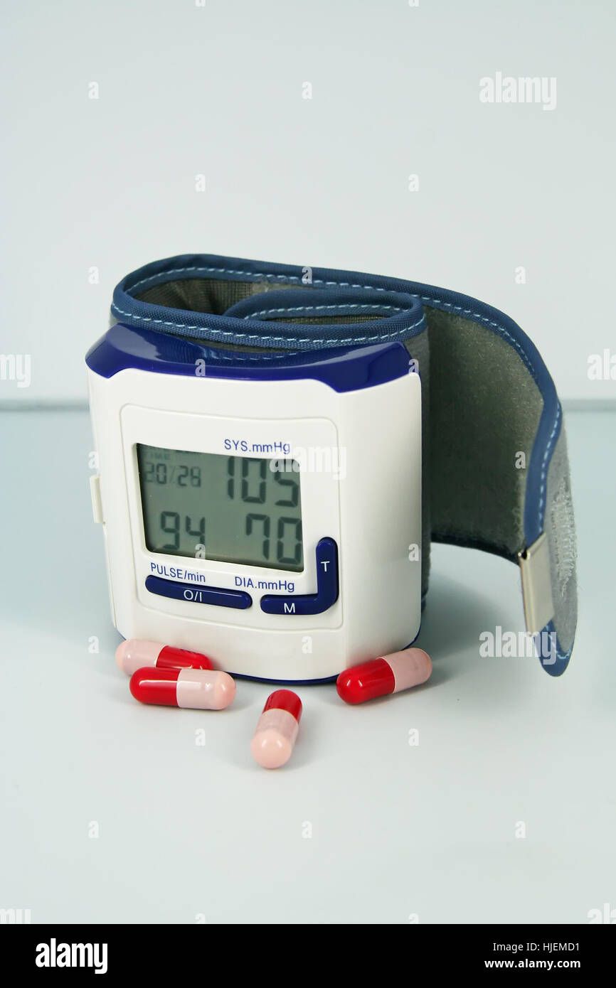 Blood pressure monitor. Medical measure instrument and pills Stock