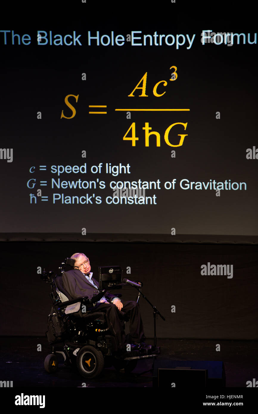 Prof. Stephen Hawking, British scientist, world renowned physicist portrait with the black hole entropy formula projection in the background, Starmus Stock Photo