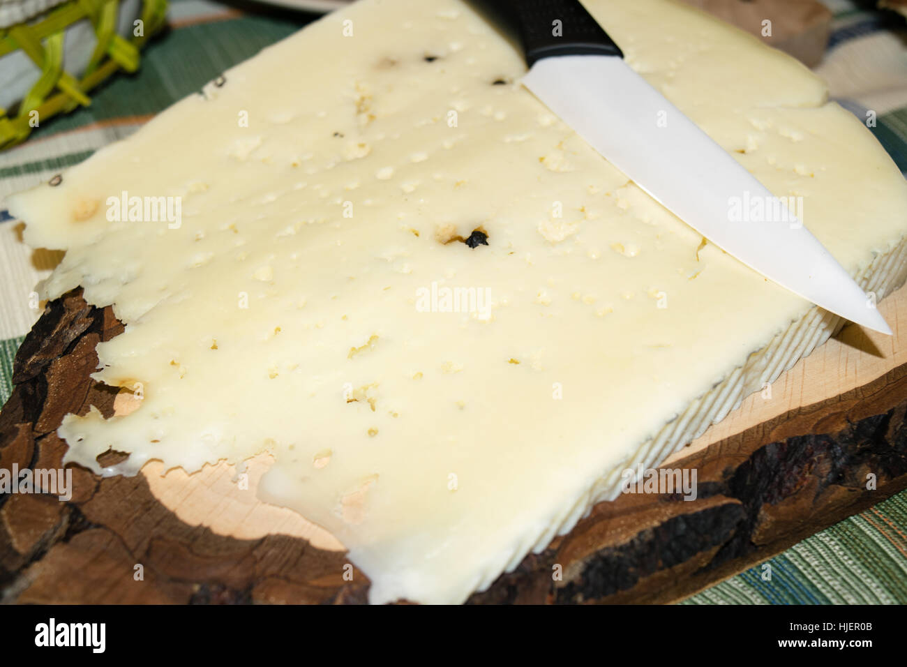 Cutting board with slice of pecorino cheese Stock Photo Alamy