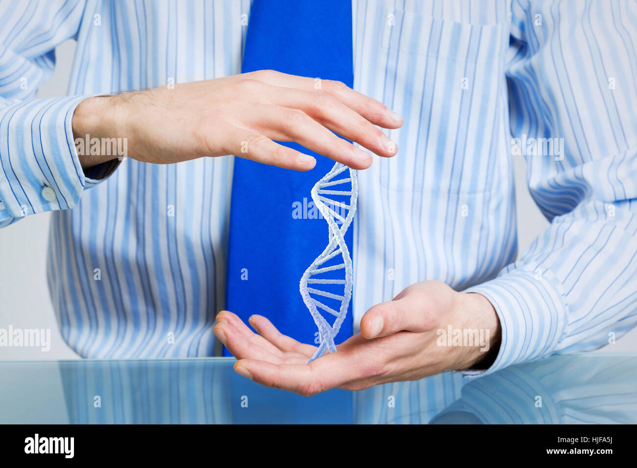 Hands of businessman holding with care molecule concept Stock Photo - Alamy