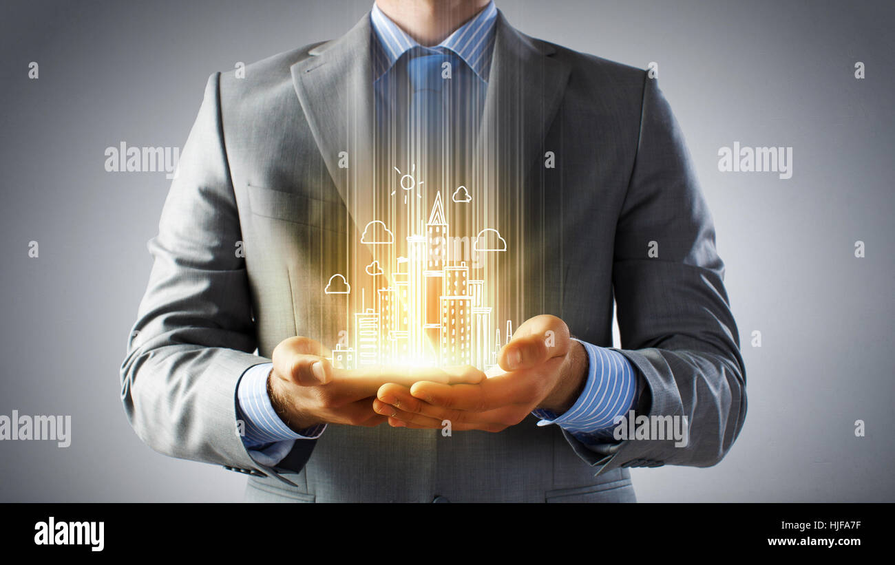 Hands of businessman and drawn building model in palms Stock Photo - Alamy