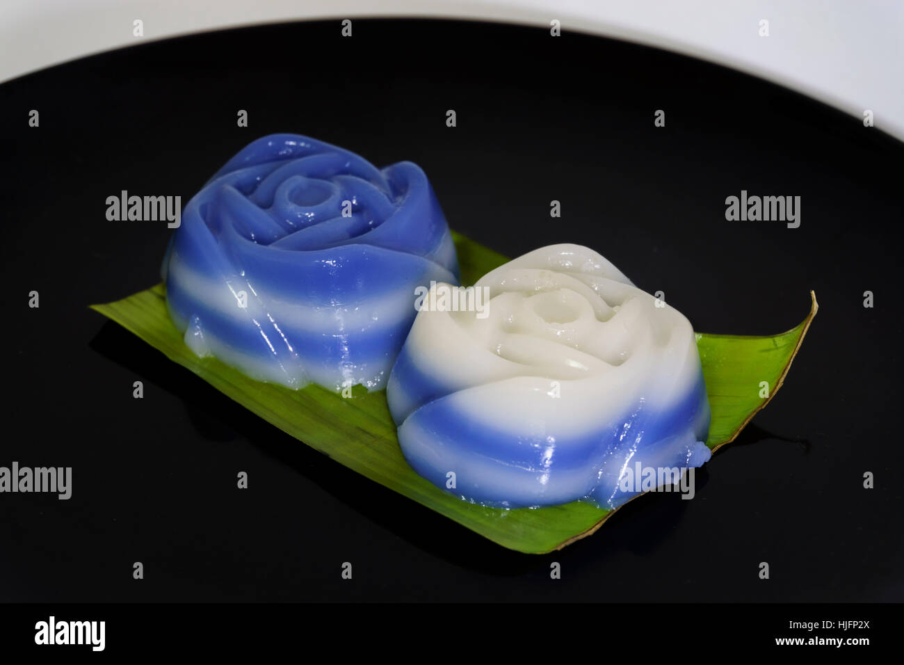 Thai traditional dessert,Khanom Chan on banana leaf, using flower mold