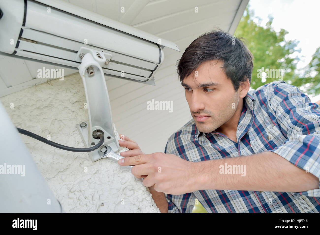 man installing video camera Stock Photo Alamy