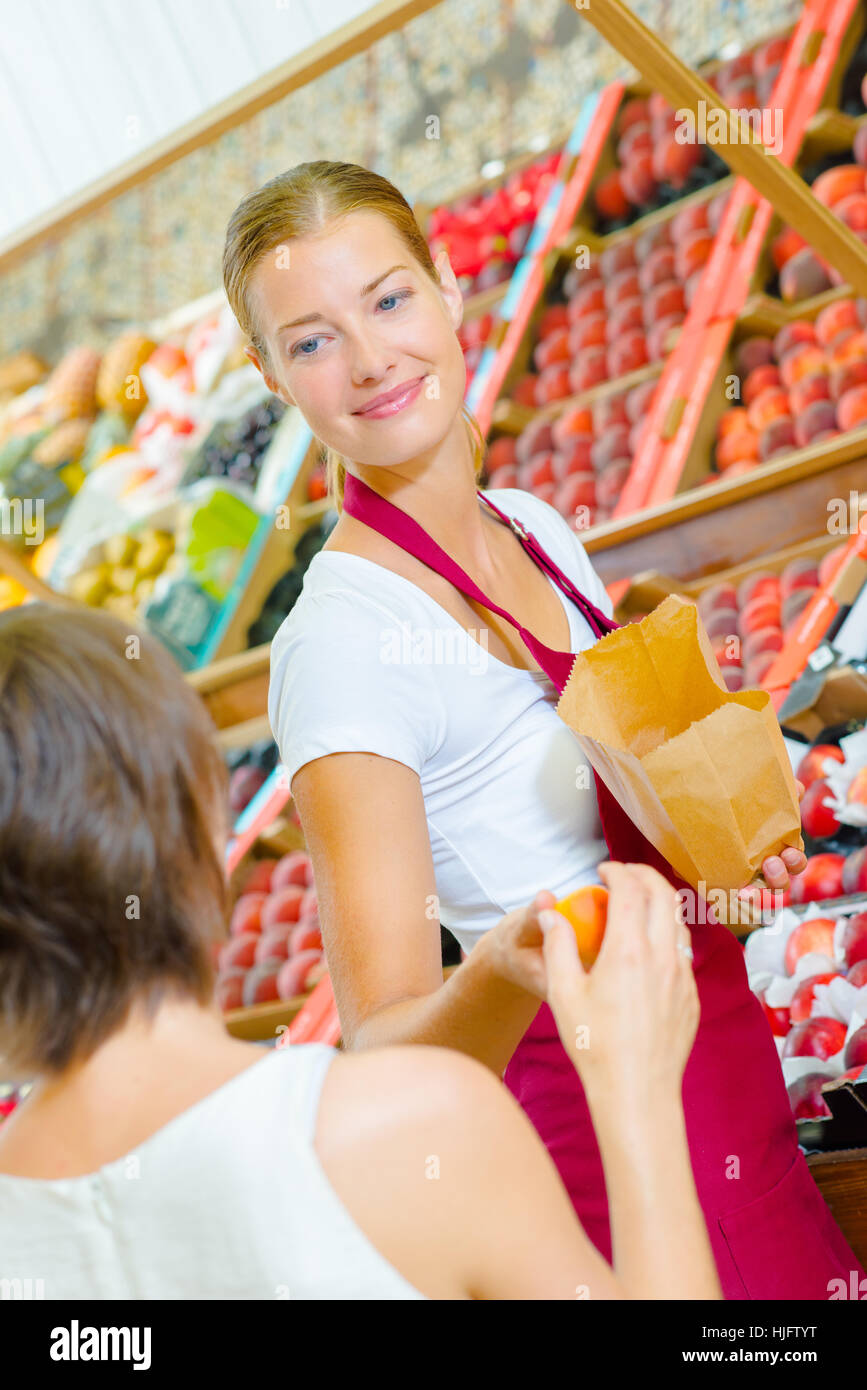 giving a fruit Stock Photo Alamy