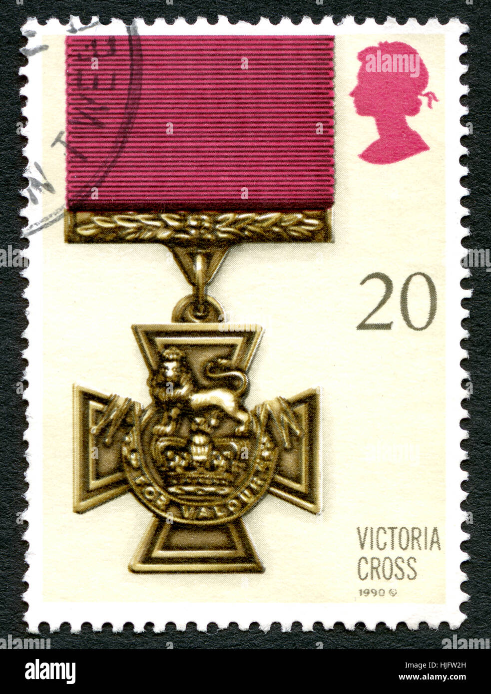 GREAT BRITAIN - CIRCA 1990: A used postage stamp from the UK, depictcing an illustration of a Victoria Cross medal - the highest award for gallantry,  Stock Photo