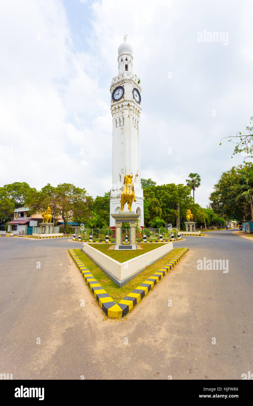 Golden horse mounted statue at intersection of white clock tower, a major landmark in downtown Jaffna, Sri Lanka Stock Photo