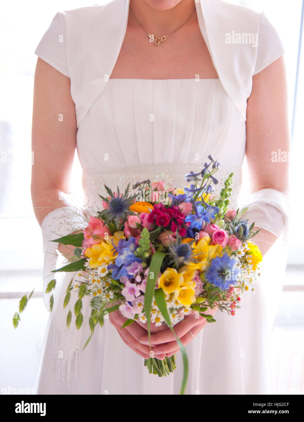 Bride,bridal gown,bridal bouquet,standing,wedding day,wedding,groom,marriage,marriage promises,forever,most beautiful,Hand,Hands Stock Photo