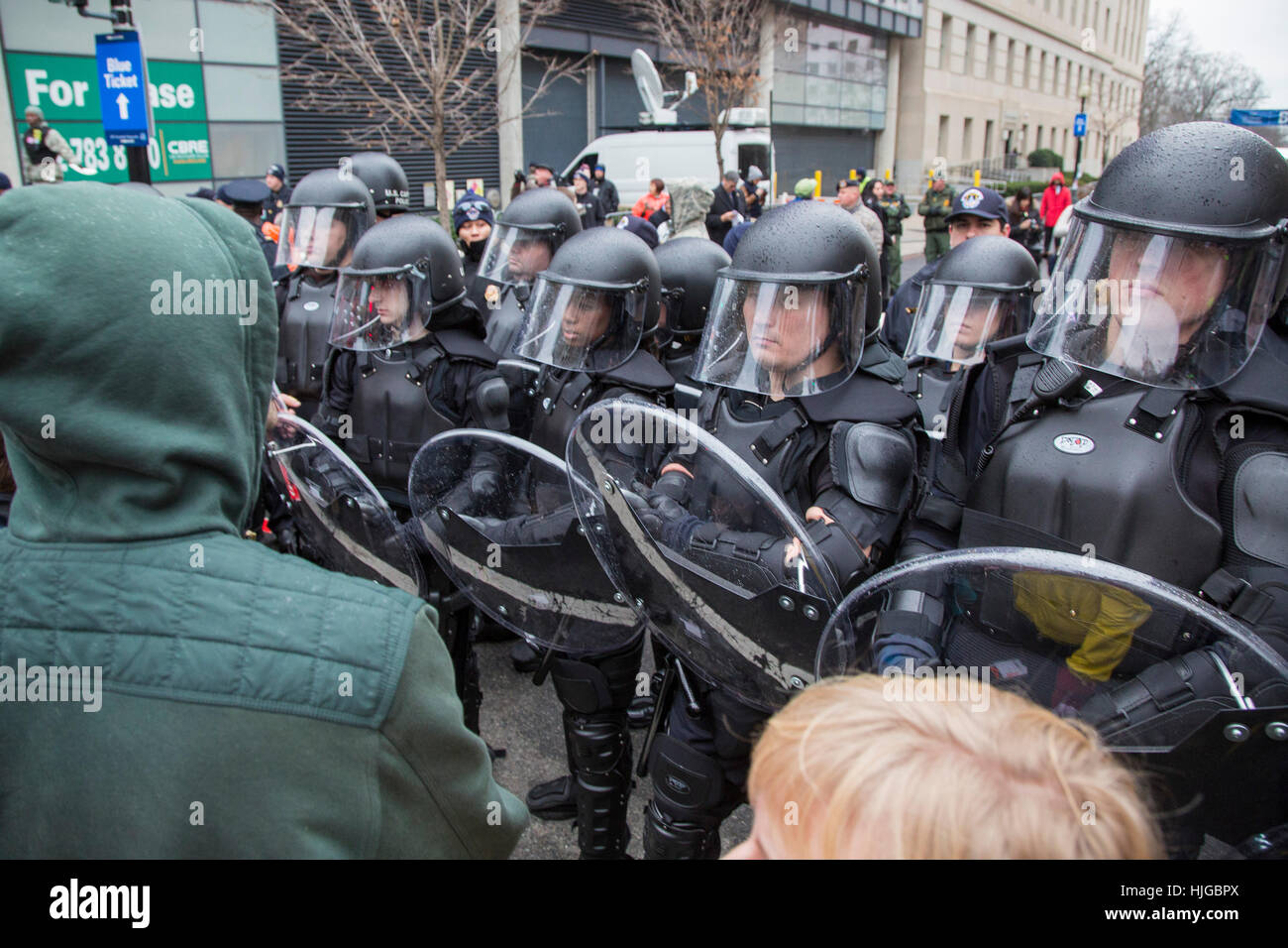 Washington, DC USA - Police in riot gear keep protesters away from a security checkpoint at the inauguration of President Trump. Stock Photo
