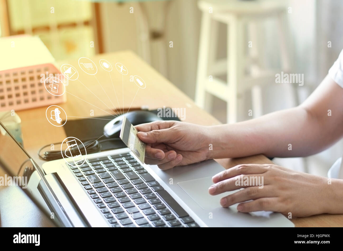 Hand holding card and using laptop for on-line shopping goods and payment service. Stock Photo