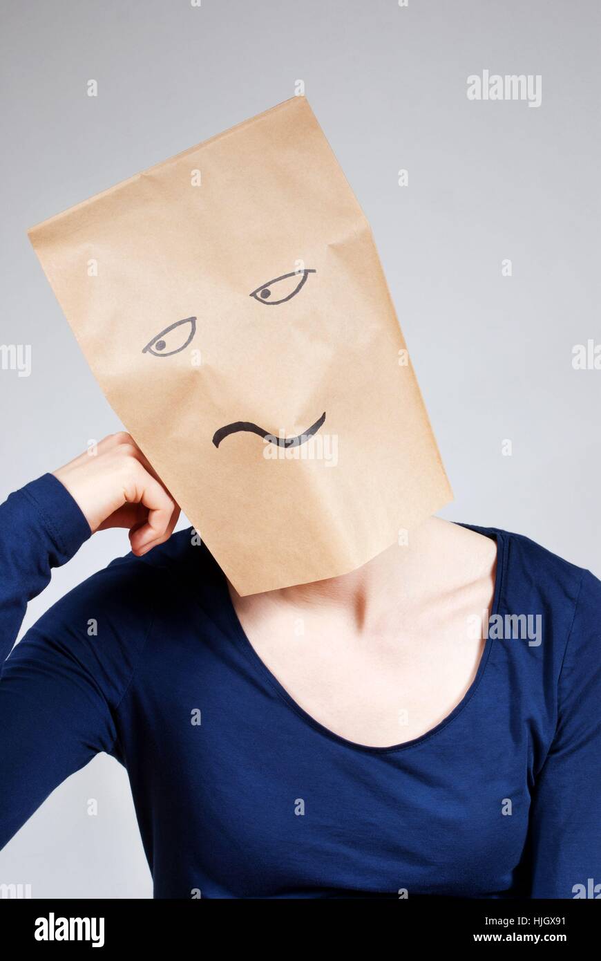 a person symbolizing boredom with a paper bag face Stock Photo - Alamy