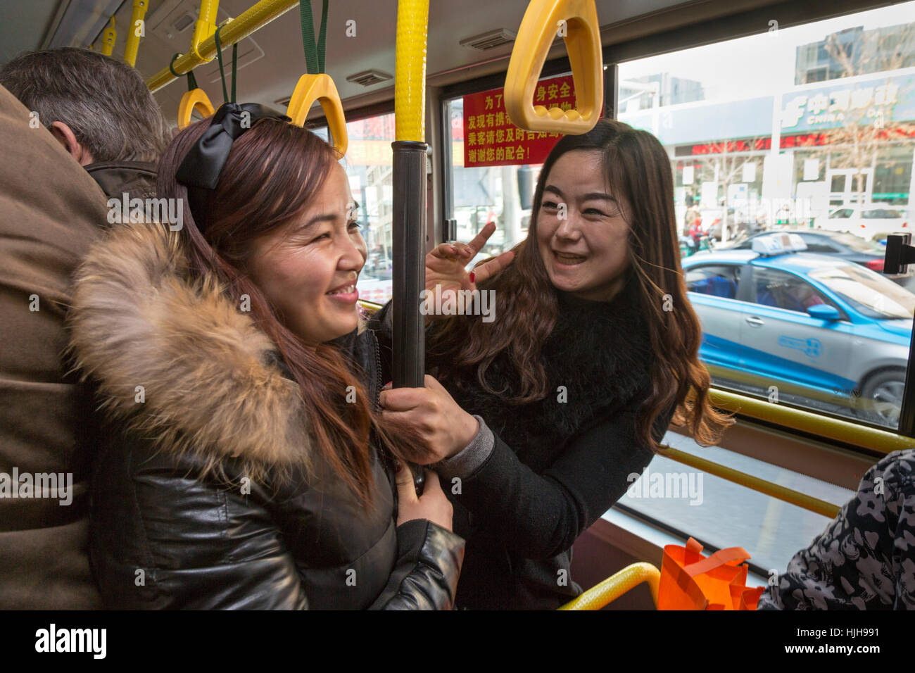 Bus passengers traveling in Wuzhong, Ningxia province, China Stock Photo