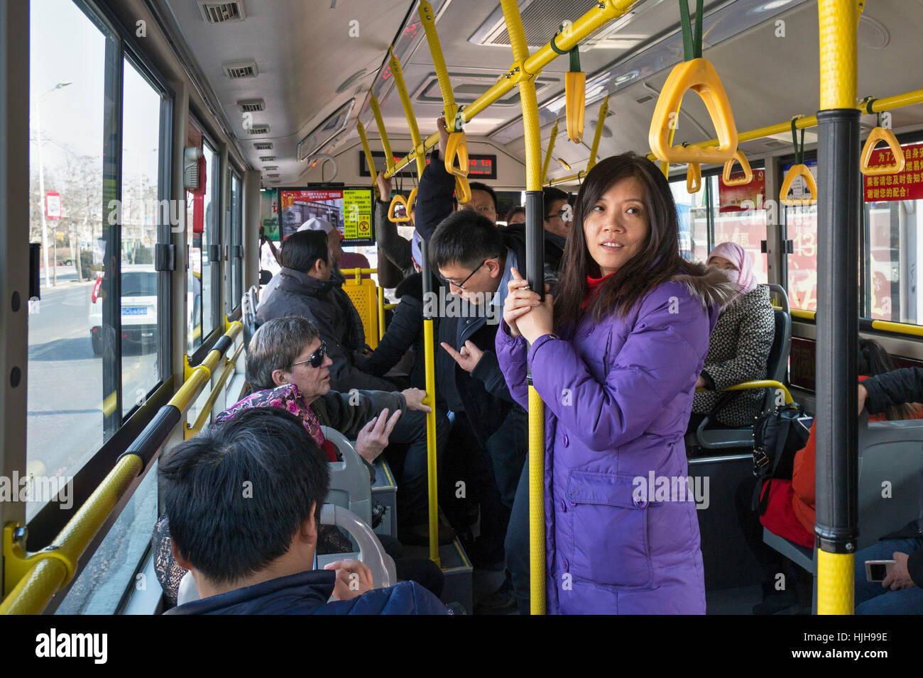 Bus passengers traveling in Wuzhong, Ningxia province, China Stock Photo