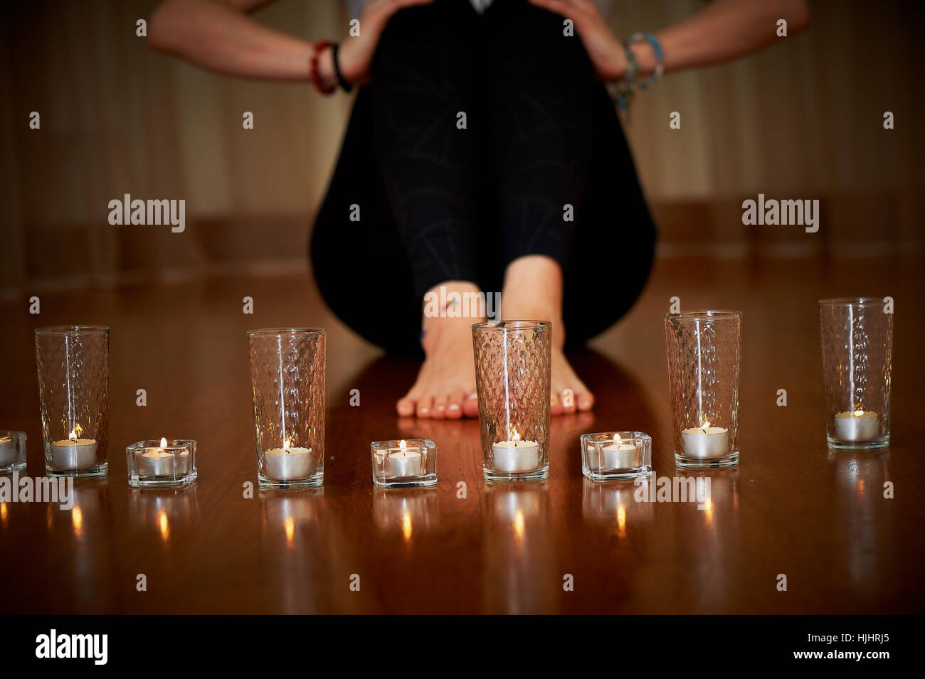 Candles lit, feet . Relaxation and yoga, meditation Stock Photo Alamy
