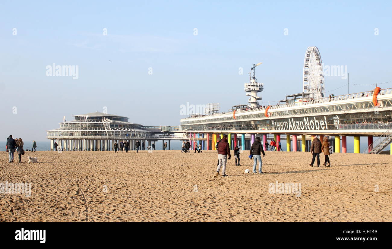 People on the beach near Scheveningen Pier at  the North Sea beach resort of Scheveningen - Den Haag (The Hague), Netherlands Stock Photo