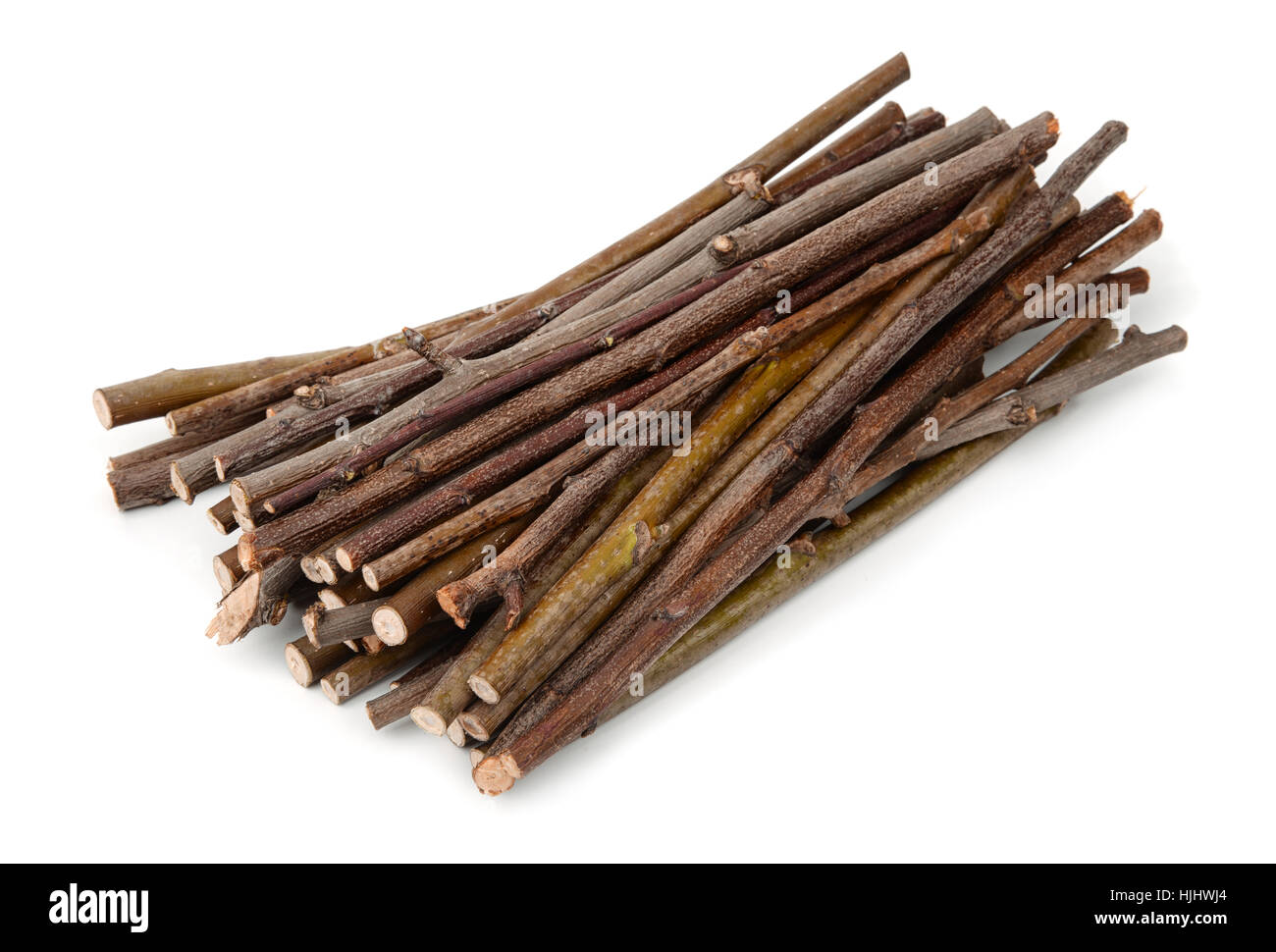 Stack of wooden twigs isolated on white Stock Photo