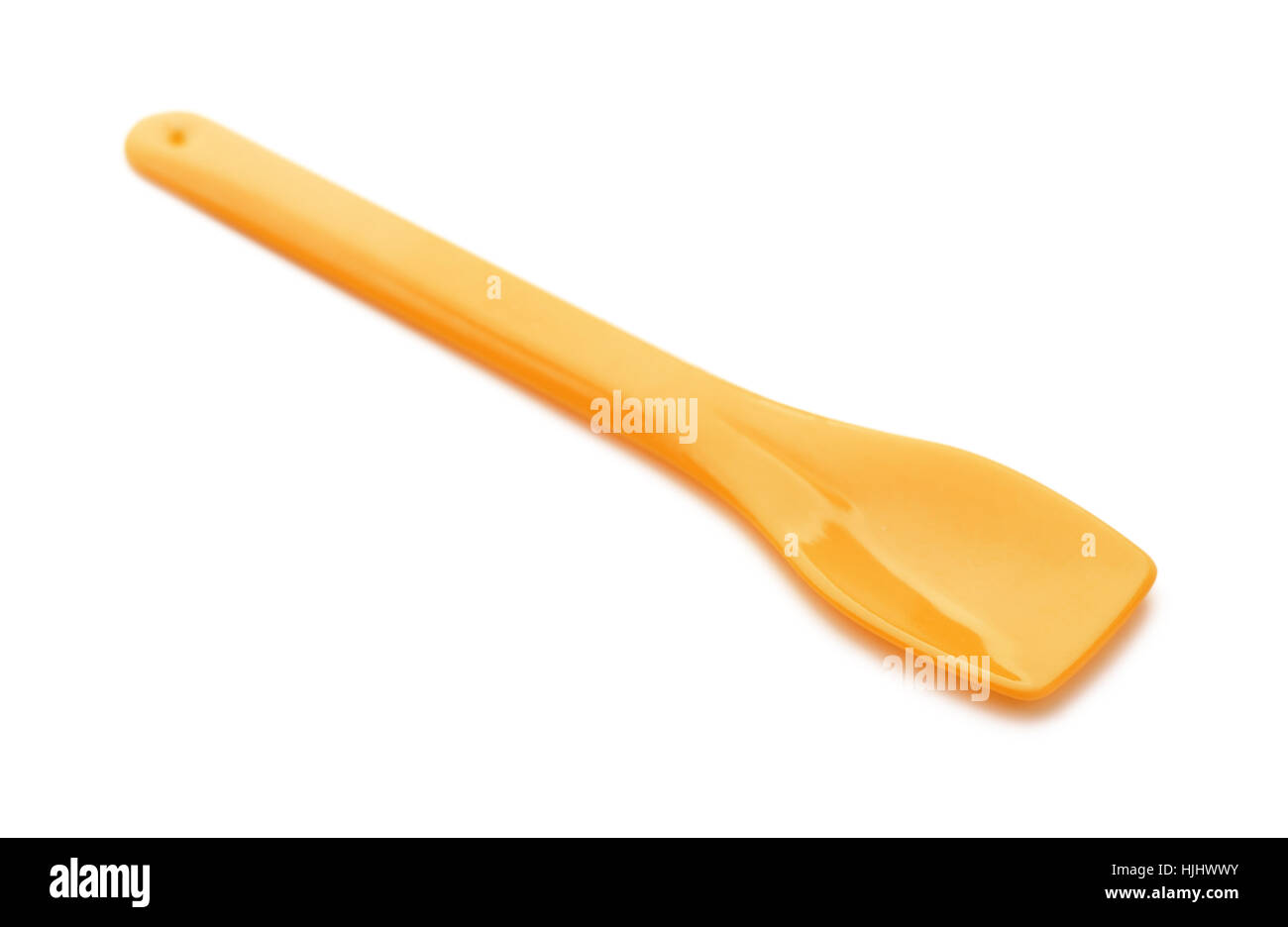 Orange plastic ice cream spoon isolated on white Stock Photo