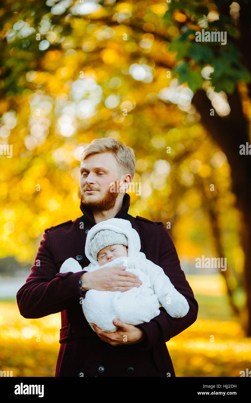 dad and newborn son in autumn park Stock Photo - Alamy
