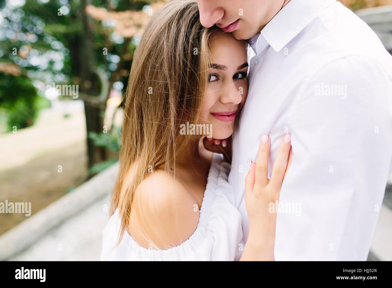 couple posing in the park Stock Photo - Alamy
