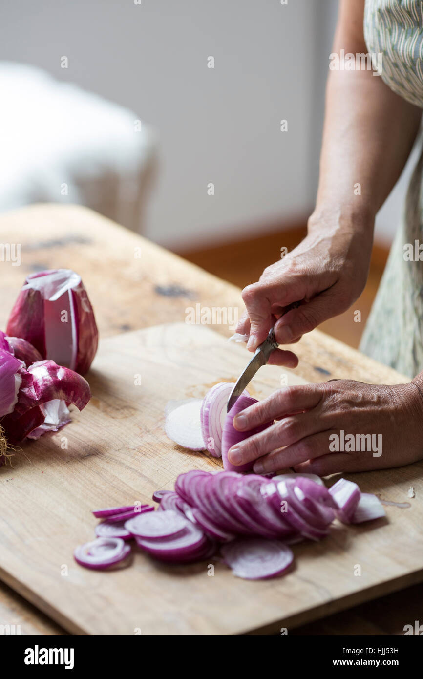 Woman cutting red onion on hi-res stock photography and images - Alamy
