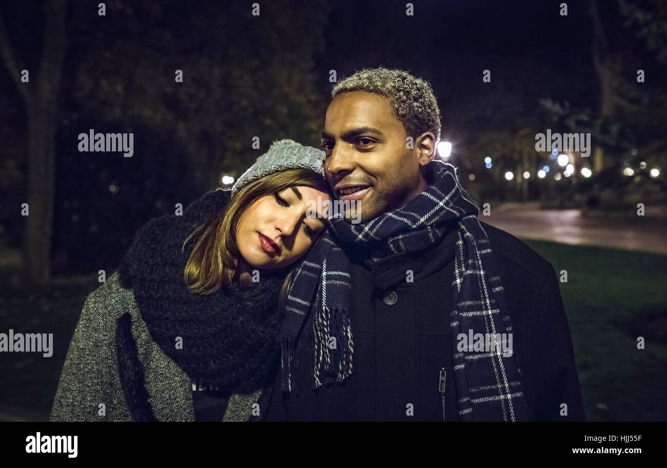 Portrait of young couple at park in winter Stock Photo - Alamy