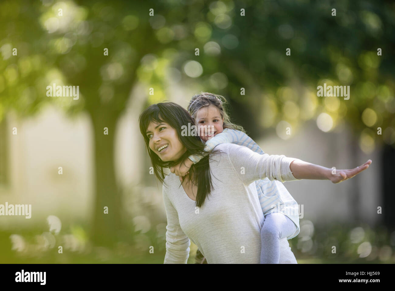 Mature woman swinging in park hi-res stock photography and images - Alamy