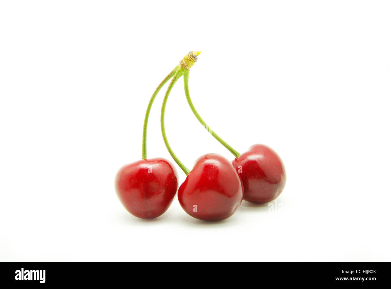 cherries against white background Stock Photo - Alamy