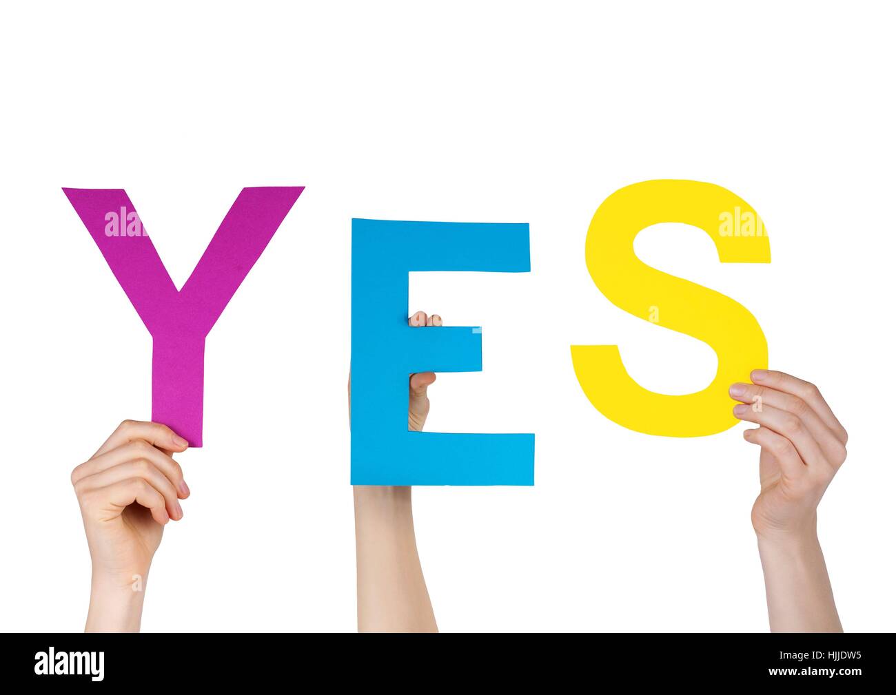 hands holding letters building the word YES, isolated Stock Photo Alamy