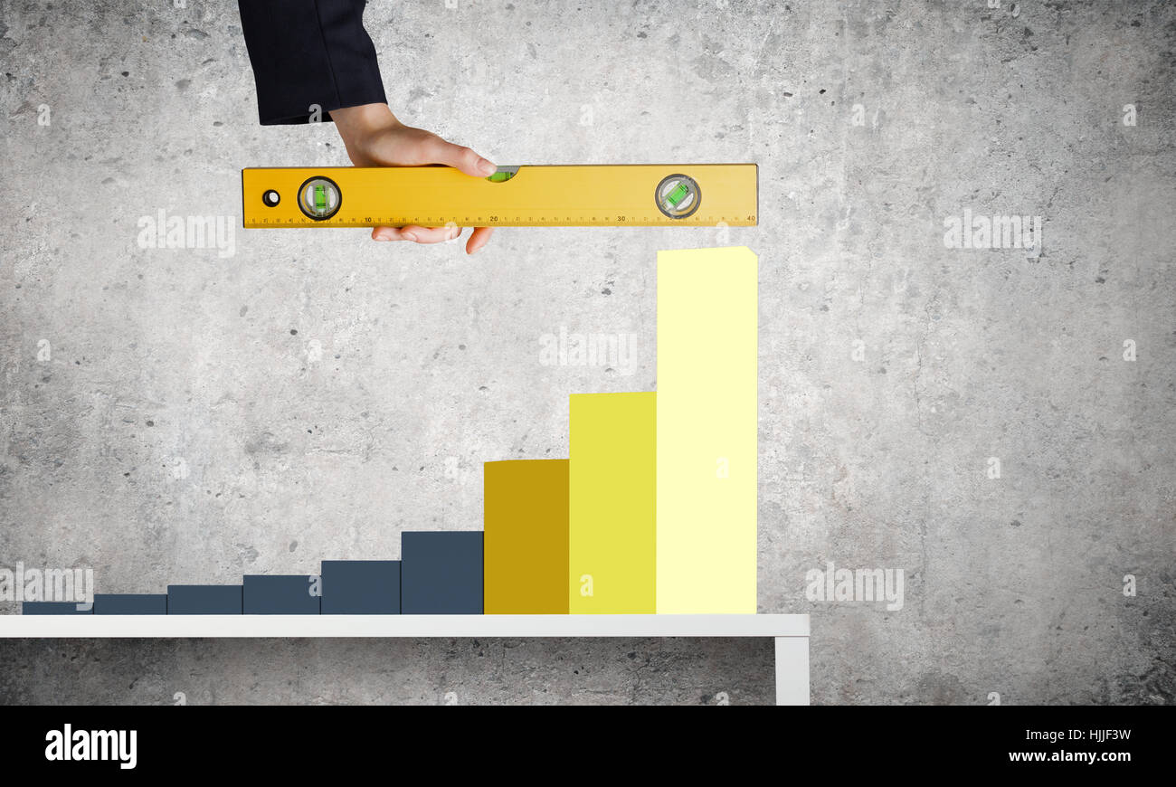 Graph About Measuring Close up of female hand measuring graph with ruler Stock Photo - Alamy