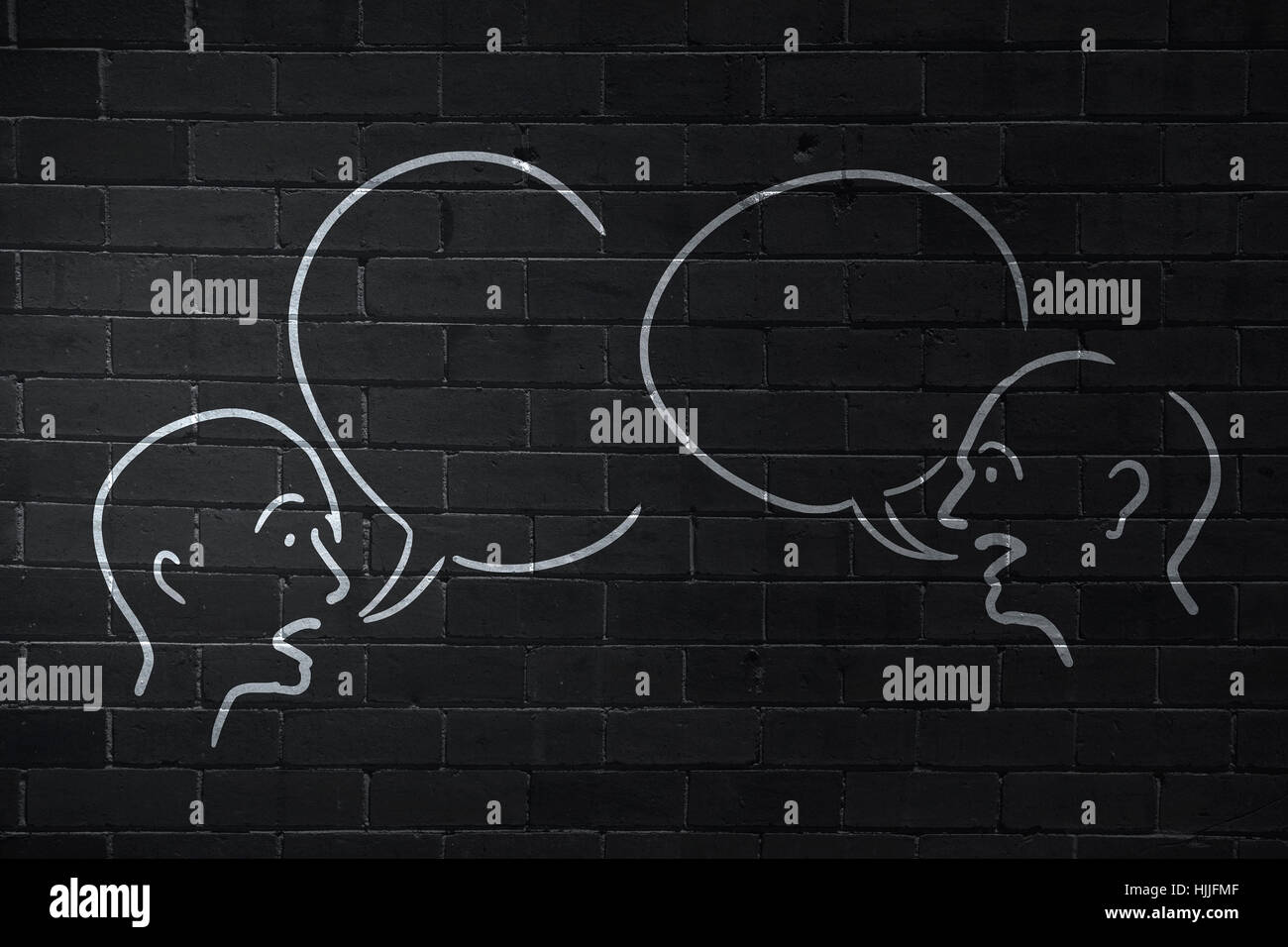 Close up of hand drawing dialogue between two on black wall Stock Photo ...