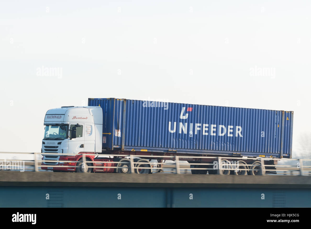 Unifeeder shipping container on lorry - Scotland, UK Stock Photo