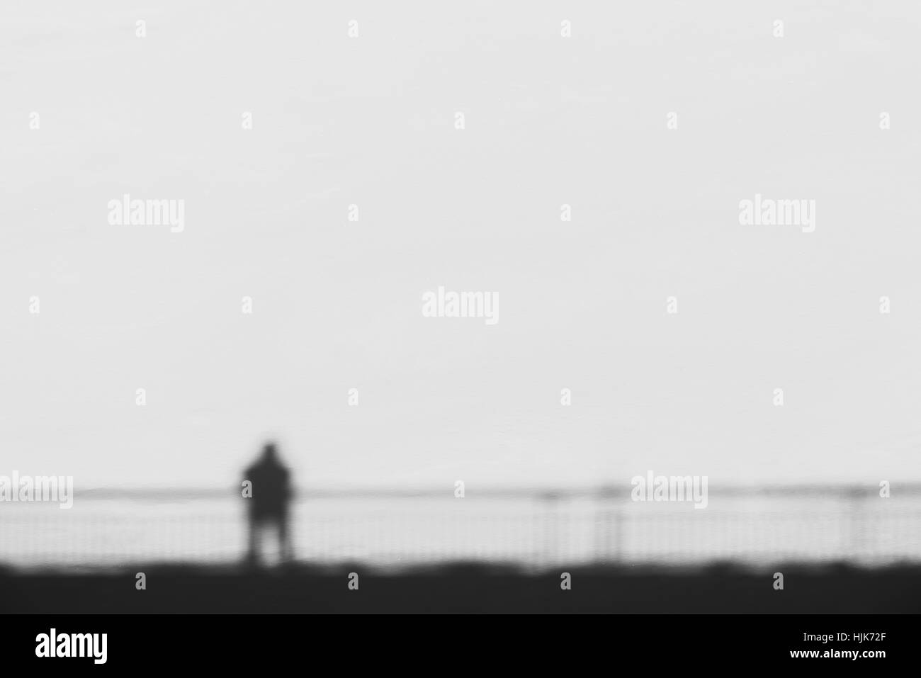 Man On A Bridge Abstract Shadow On Snow Stock Photo - Alamy