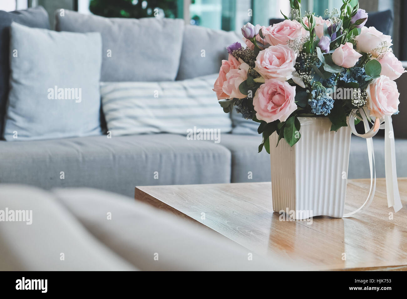 Beautiful Pink Rose In Vase On Table In Living Room Stock Photo Alamy