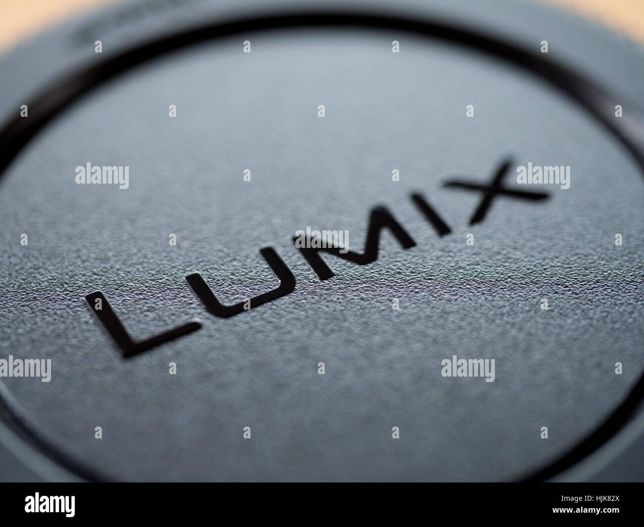 The word Lumix from a Panasonic Lumix lens cap Stock Photo