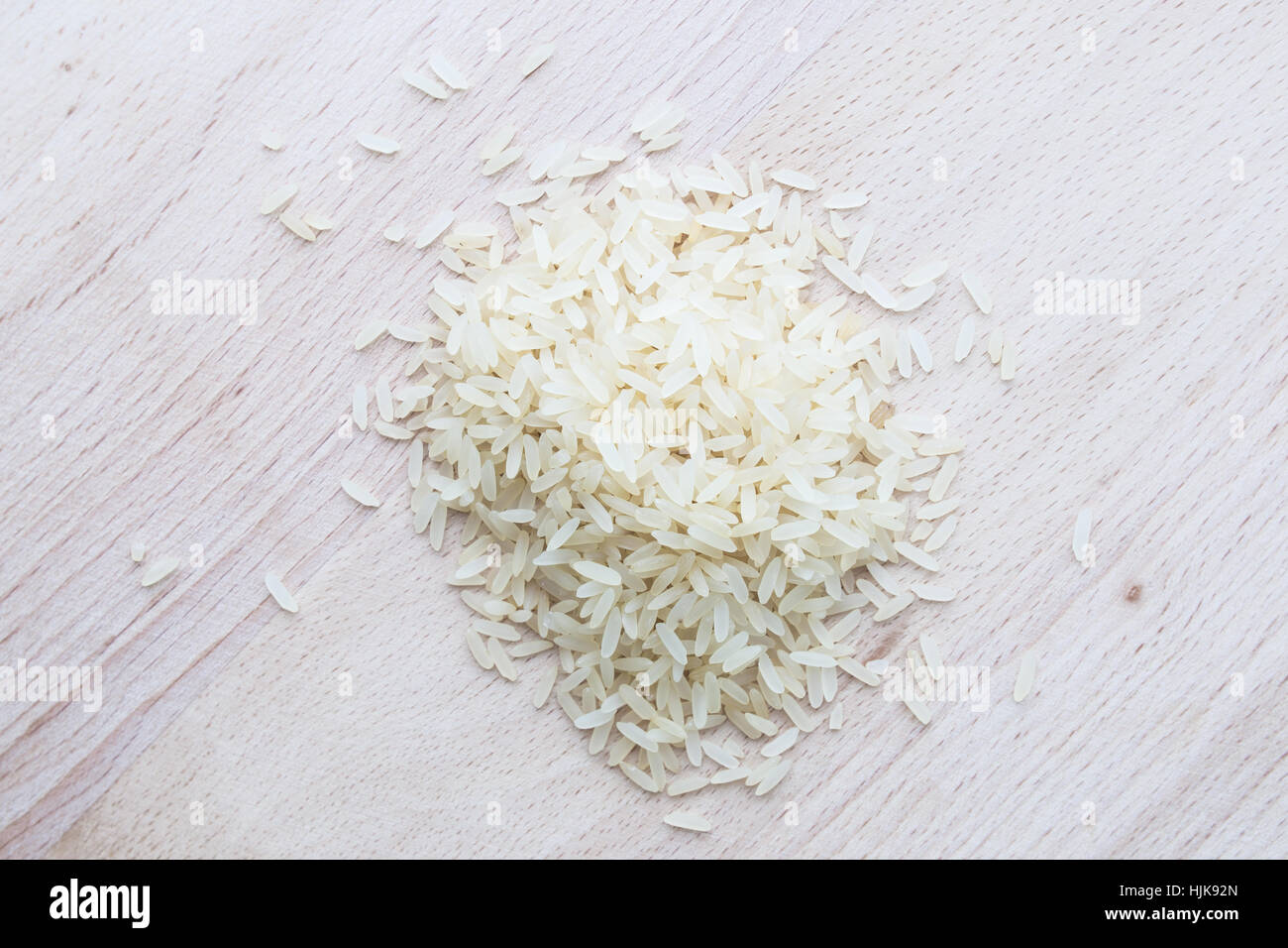 Studio Photo Rice rice on wooden background. studio shot raw food Stock Photo - Alamy